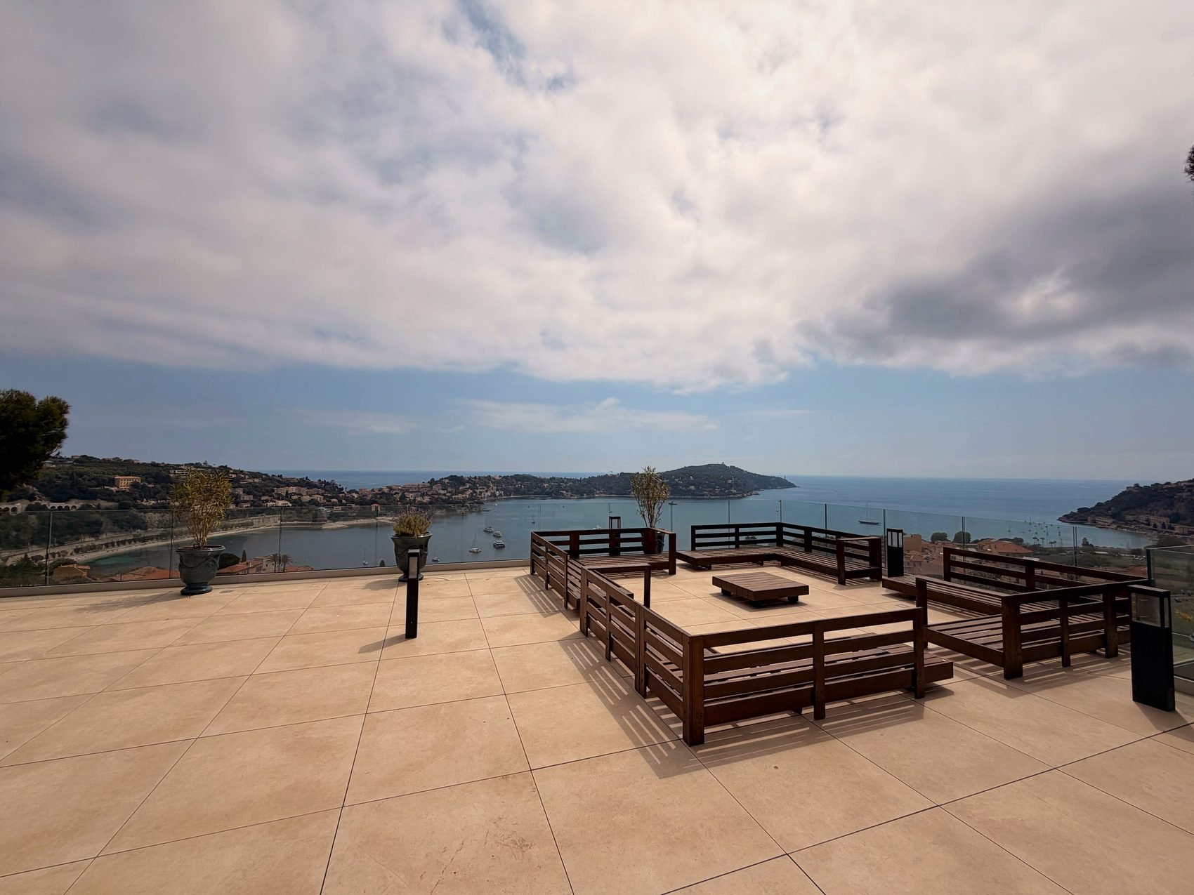 Rooftop terrace with lounge seating and panoramic views to Saint-Jean-Cap-Ferrat